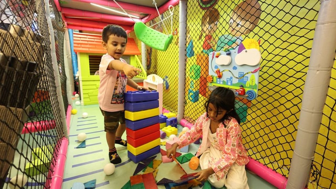 Kids playing joyfully in indoor play zone
